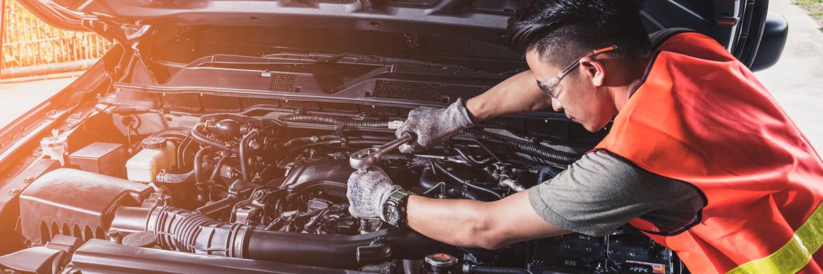 technician repairing or modify the car's engine in the garage. the concept of automotive, repairing, mechanical, vehicle and technology.